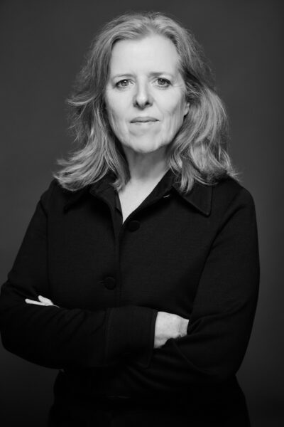 Close up of women, folded arms and black top.